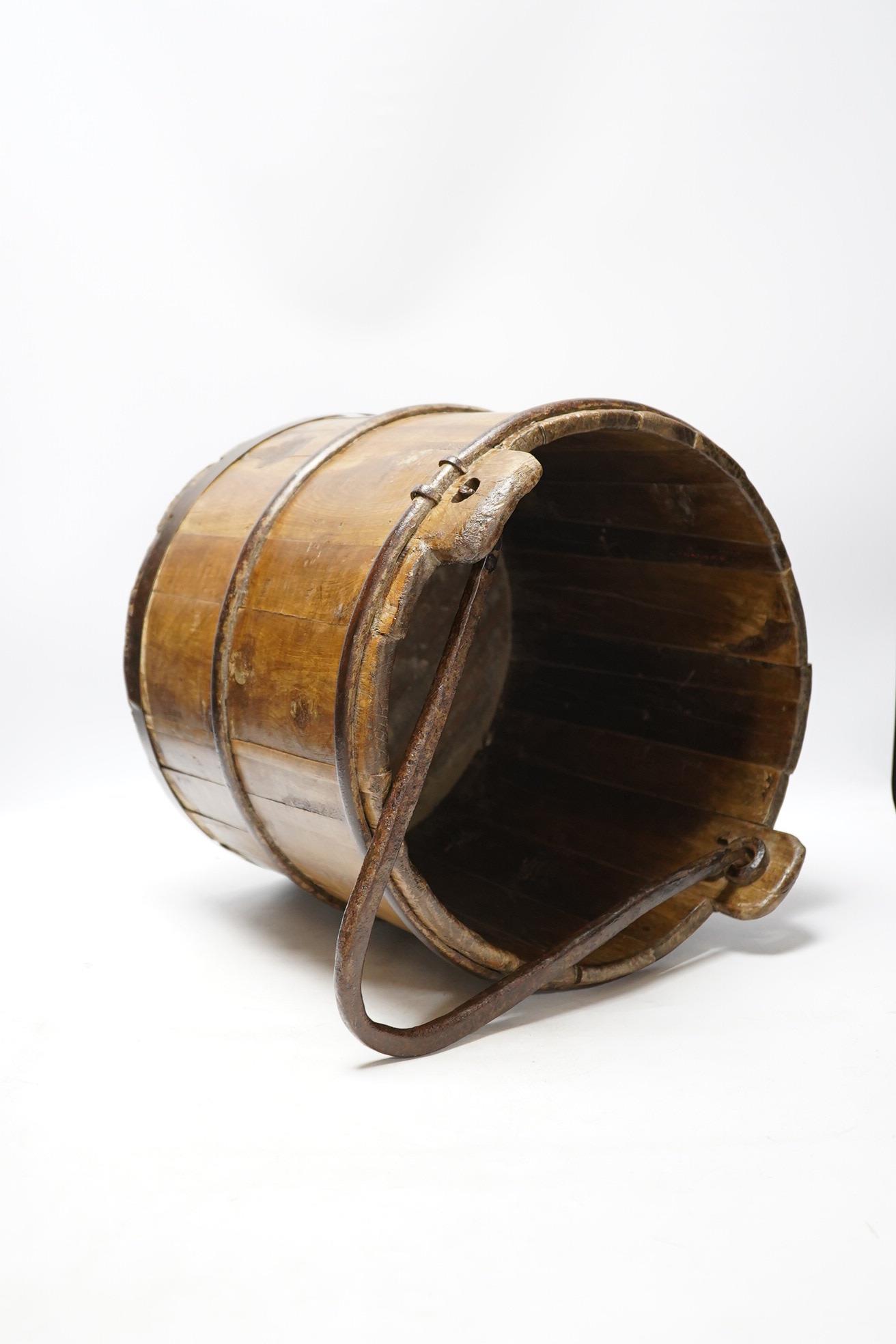 A 19th century coopered well bucket, 34cm. Condition - fair